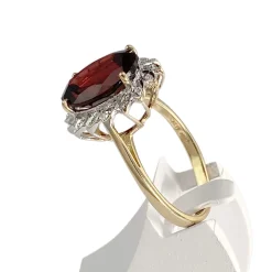 Bague d'occasion 2 ors 750 grenat diamants