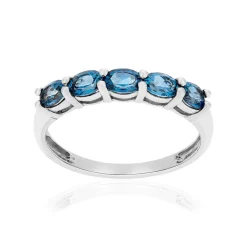 Bague or 375 blanc topaze bleues traitées