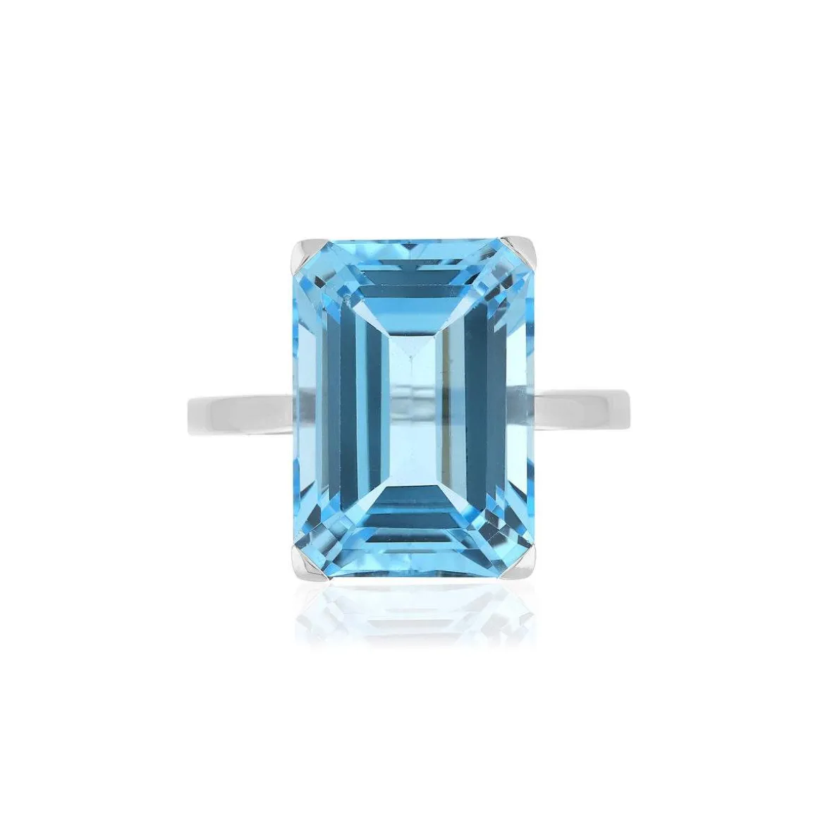 Bague or blanc 750, 1 topaze bleue traitée de 10,50 carats.