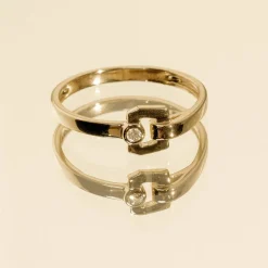 Bague or 750 jaune boucle et diamant