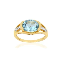 Bague or 375 2 tons, topaze bleue traitée, diamants.