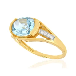 Bague or 375 2 tons, topaze bleue traitée, diamants.