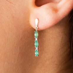 Boucles d'oreilles or 375 2 tons émeraudes ovales et diamants