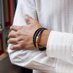 Bracelet multirang matière synthétique noire acier couleur jaune 21 cm