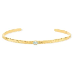 Bracelet plaqué or jaune strié pierre synthétique bleue 58 mm.