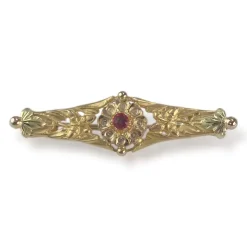 Broche d'occasion or 750 jaune doublet grenat verre