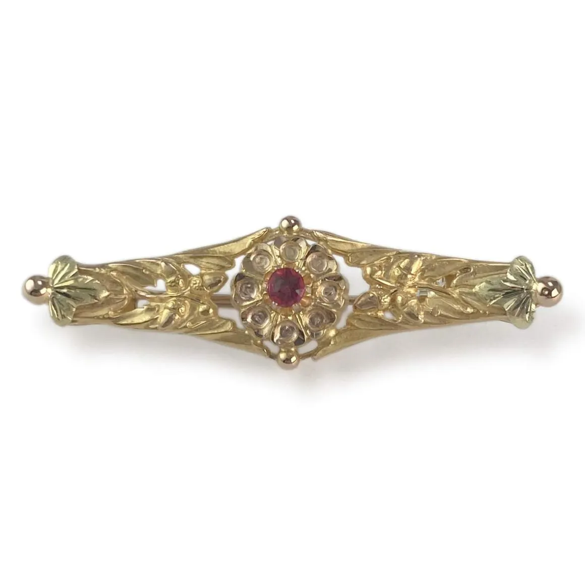 Broche d'occasion or 750 jaune doublet grenat verre