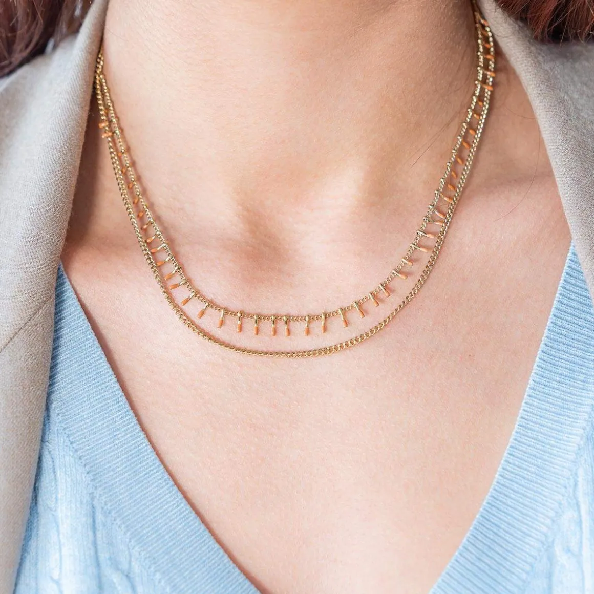 Collier acier doré 2 rangs laque orange 45,5 cm