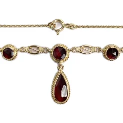 Collier d'occasion or 750 jaune maille forcat grenat