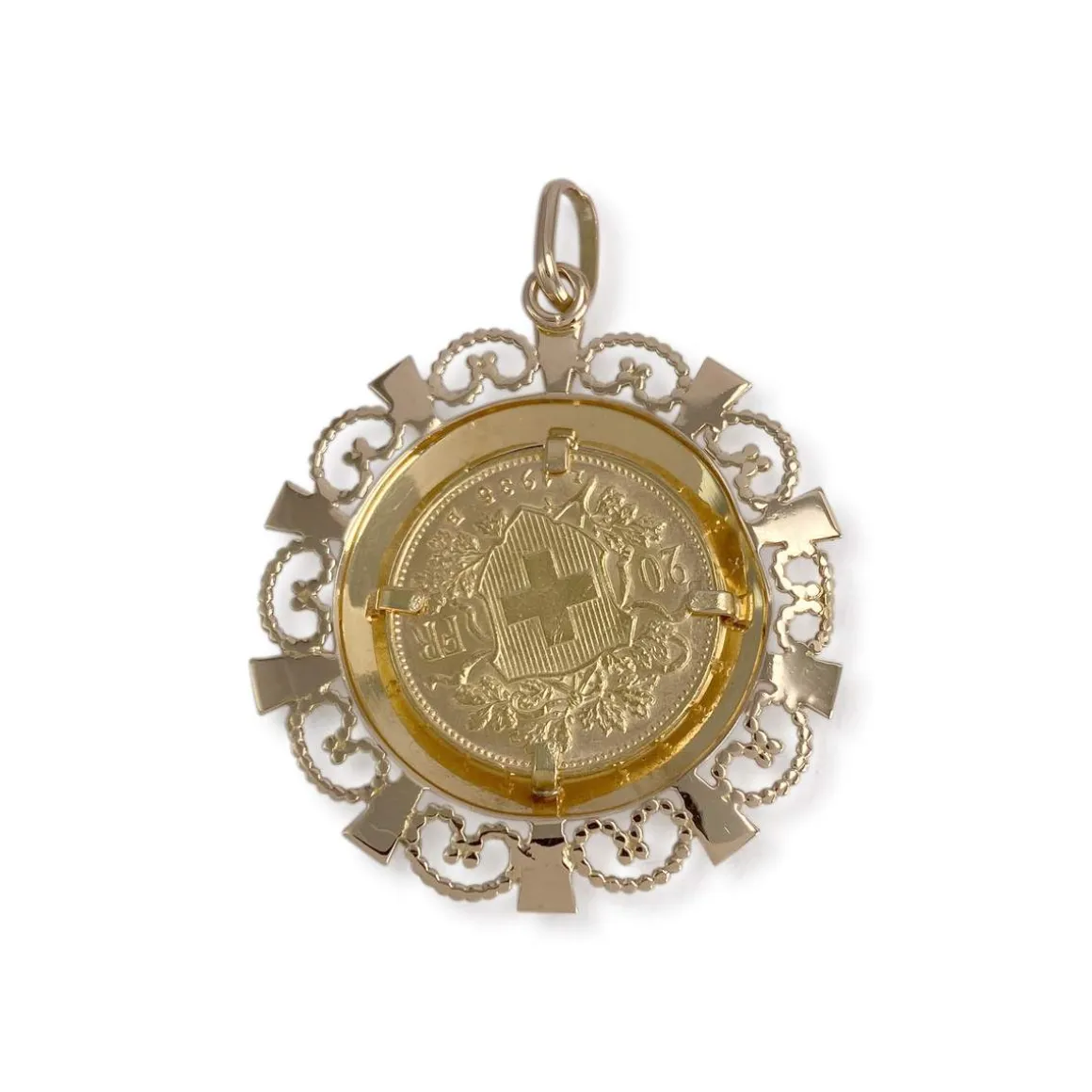 Médaille d'occasion or 750 jaune Helvetia rubis synthétiques