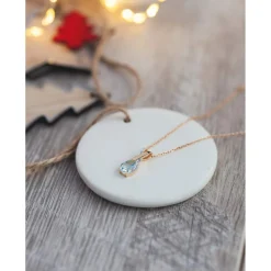 Pendentif or 750 2 tons topaze bleue traitée taille poire et diamants